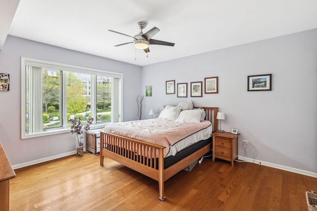 5155 Madison St Unit 204, Skokie, IL 60077 - bedroom with baseboards, light wood-style floors, and a ceiling fan