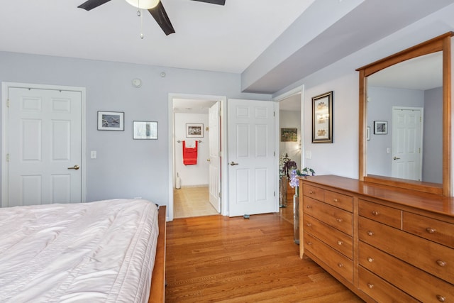 5155 Madison St Unit 204, Skokie, IL 60077 - bedroom featuring light wood-type flooring, ceiling fan, and connected bathroom