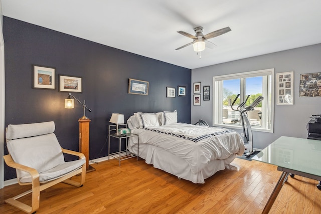 5155 Madison St Unit 204, Skokie, IL 60077 - bedroom with light wood finished floors, an accent wall, baseboards, and a ceiling fan