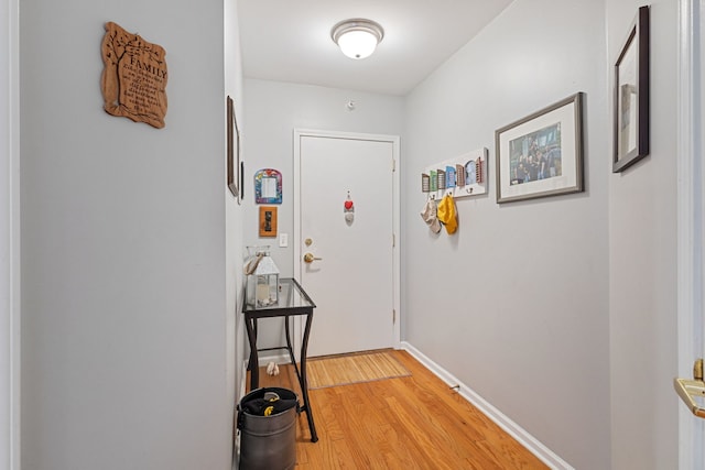 5155 Madison St Unit 204, Skokie, IL 60077 - doorway featuring light wood-style flooring and baseboards