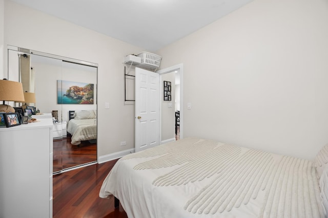 3848 N Lamon Ave Unit 1, Chicago, IL 60641 - bedroom featuring a closet, dark wood-style floors, and baseboards