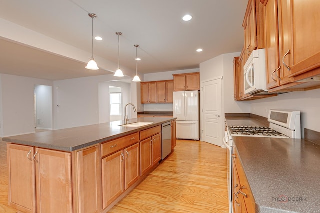 3629 Canton Cir, Mundelein, IL 60060 - kitchen featuring white appliances, a sink, dark countertops, recessed lighting, and a center island with sink