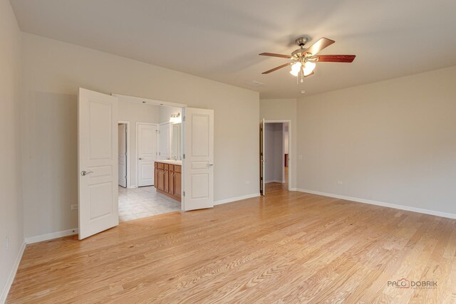 3629 Canton Cir, Mundelein, IL 60060 - empty room featuring ceiling fan, light wood finished floors, and baseboards