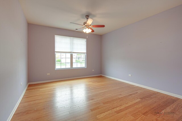 3629 Canton Cir, Mundelein, IL 60060 - empty room featuring a ceiling fan, light wood-style flooring, and baseboards