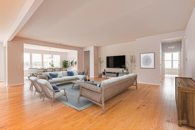 3629 Canton Cir, Mundelein, IL 60060 - living area featuring light wood finished floors, baseboards, and a chandelier