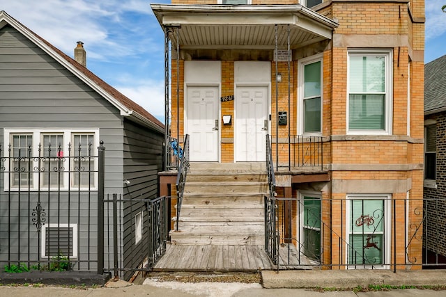 9841 S Ewing Ave, Chicago, IL 60617 - property entrance with brick siding and fence