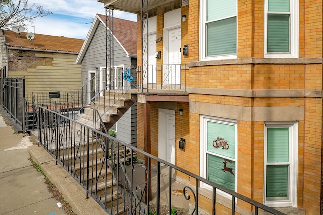 9841 S Ewing Ave, Chicago, IL 60617 - view of exterior entry featuring brick siding and fence