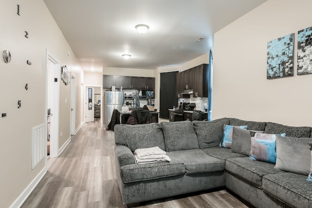 9841 S Ewing Ave, Chicago, IL 60617 - living area featuring light wood-type flooring and baseboards