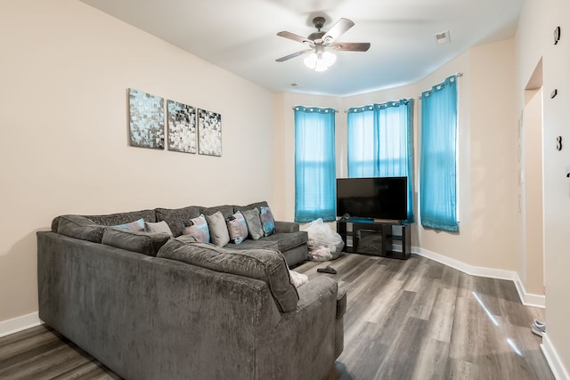 9841 S Ewing Ave, Chicago, IL 60617 - living room featuring wood finished floors, a ceiling fan, and baseboards