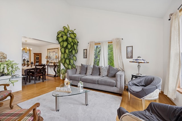 4 W Tall Oak Dr, Hainesville, IL 60073 - living room featuring a chandelier, light wood-style flooring, and high vaulted ceiling