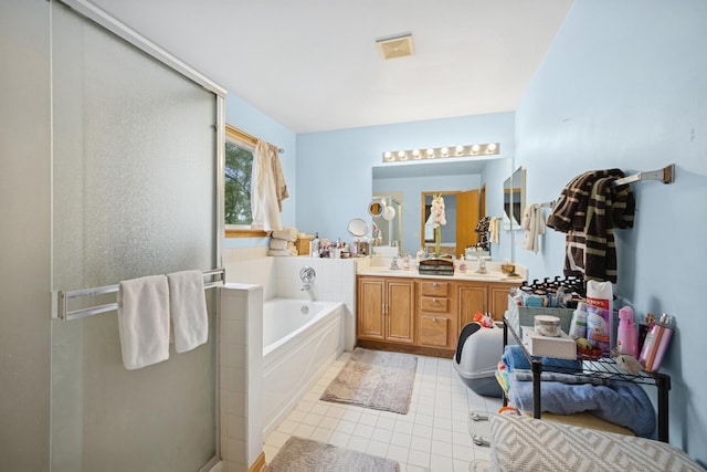 4 W Tall Oak Dr, Hainesville, IL 60073 - full bathroom with double vanity, a garden tub, a shower stall, and tile patterned flooring