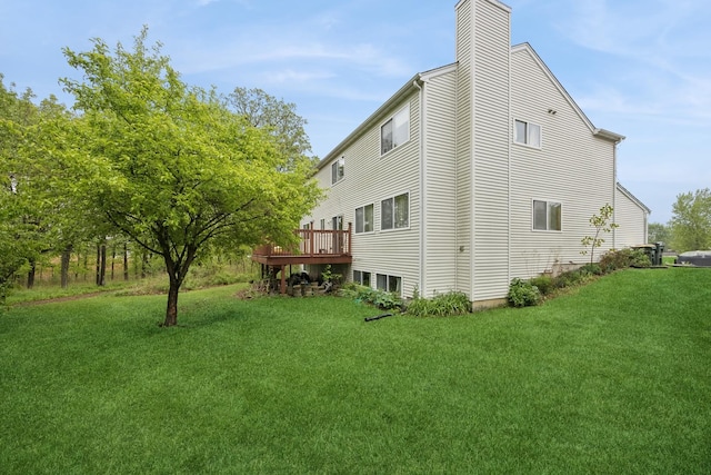 4 W Tall Oak Dr, Hainesville, IL 60073 - view of property exterior with a lawn, a chimney, and a deck