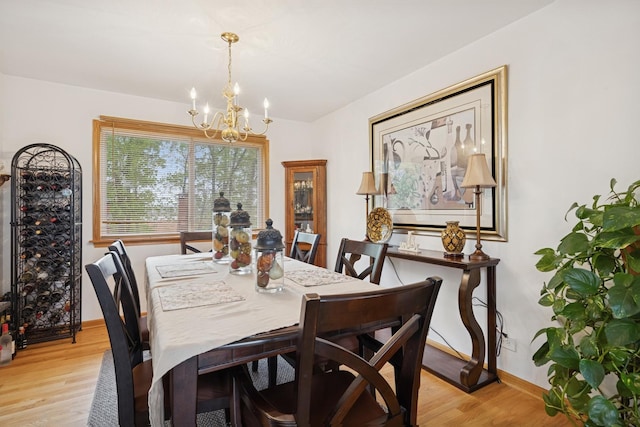 4 W Tall Oak Dr, Hainesville, IL 60073 - dining area with a chandelier, light wood finished floors, and baseboards