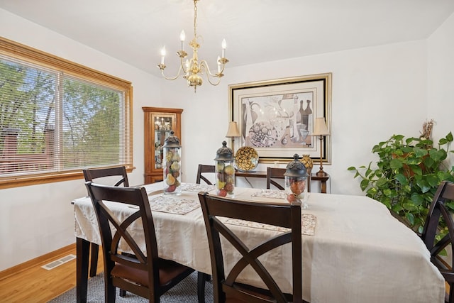 4 W Tall Oak Dr, Hainesville, IL 60073 - dining space featuring a chandelier and wood finished floors