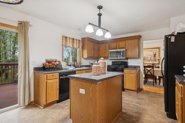 4 W Tall Oak Dr, Hainesville, IL 60073 - kitchen featuring black appliances, a sink, dark countertops, and a center island