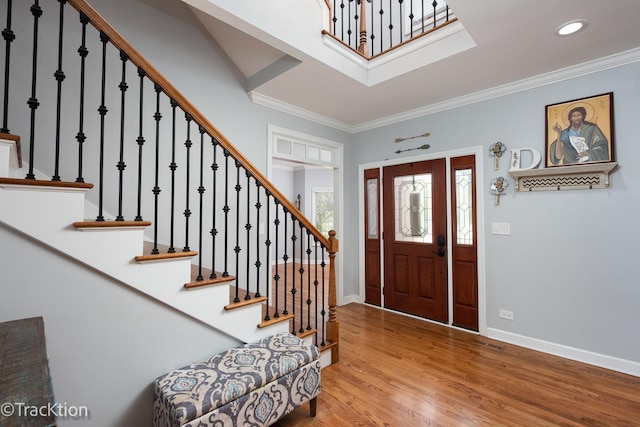 504 Lindley Ave, Westmont, IL 60559 - foyer featuring stairway, baseboards, wood finished floors, ornamental molding, and recessed lighting