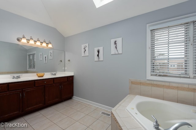 504 Lindley Ave, Westmont, IL 60559 - full bath with vaulted ceiling, tile patterned floors, a bath, baseboards, and double vanity