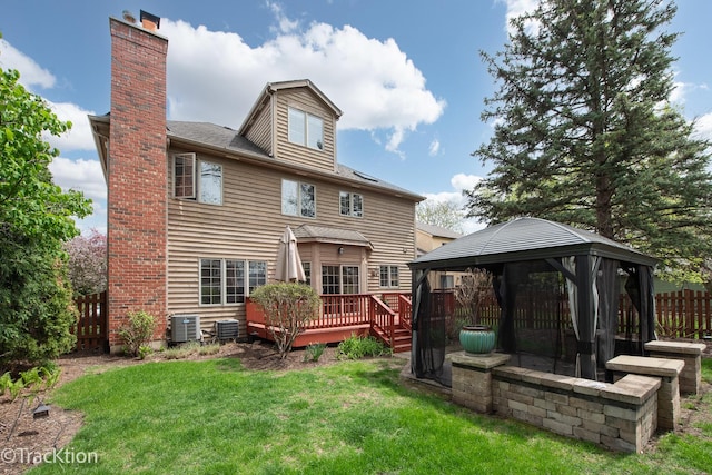 504 Lindley Ave, Westmont, IL 60559 - back of property featuring a gazebo, a wooden deck, a chimney, and central AC