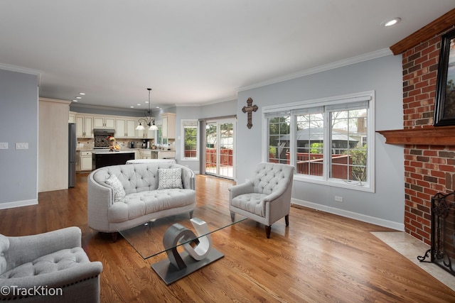 504 Lindley Ave, Westmont, IL 60559 - living room featuring a brick fireplace, wood finished floors, baseboards, ornamental molding, and recessed lighting