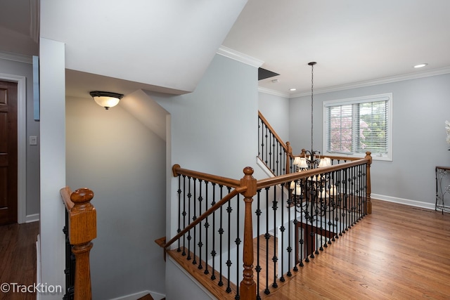 504 Lindley Ave, Westmont, IL 60559 - stairway featuring wood finished floors, baseboards, ornamental molding, recessed lighting, and a chandelier