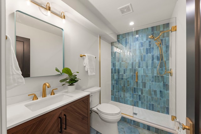 bathroom featuring a shower stall, toilet, vanity, and recessed lighting