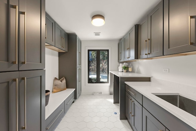 mudroom with light tile patterned flooring