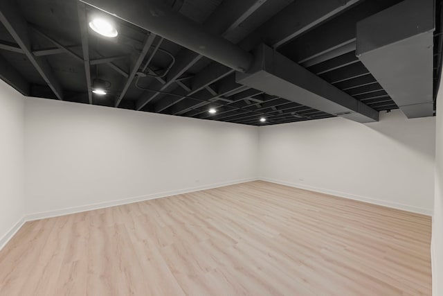 finished basement with wood finished floors and baseboards
