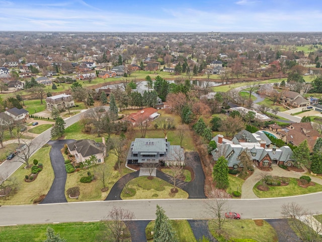 aerial overview of property's location with nearby suburban area and a nearby body of water