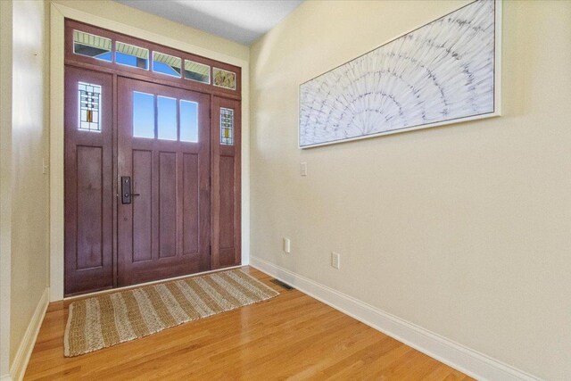 2297 Deer Ridge Ct, Carlock, IL 61725 - entrance foyer with light wood finished floors and baseboards