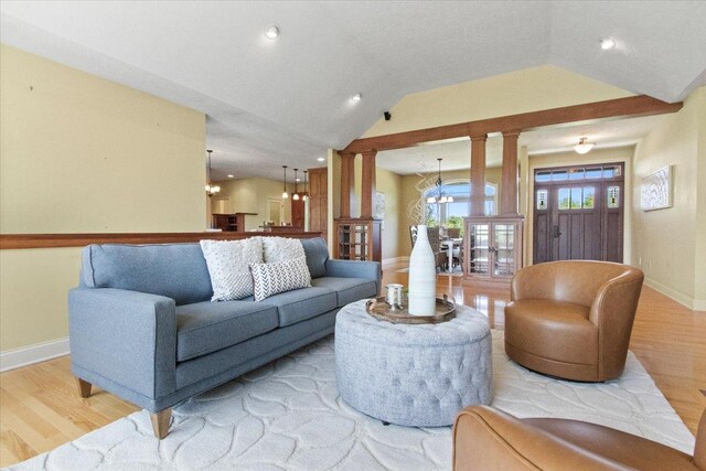 2297 Deer Ridge Ct, Carlock, IL 61725 - living area with a chandelier, light wood-style floors, baseboards, lofted ceiling, and recessed lighting