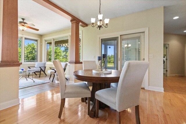2297 Deer Ridge Ct, Carlock, IL 61725 - dining area featuring ornate columns, a chandelier, baseboards, light wood-style floors, and recessed lighting