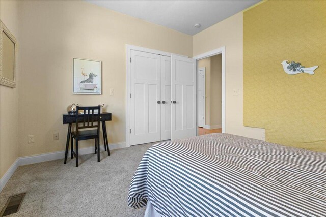 2297 Deer Ridge Ct, Carlock, IL 61725 - bedroom with light colored carpet, a closet, and baseboards