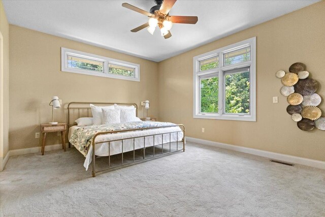 2297 Deer Ridge Ct, Carlock, IL 61725 - carpeted bedroom with baseboards and a ceiling fan