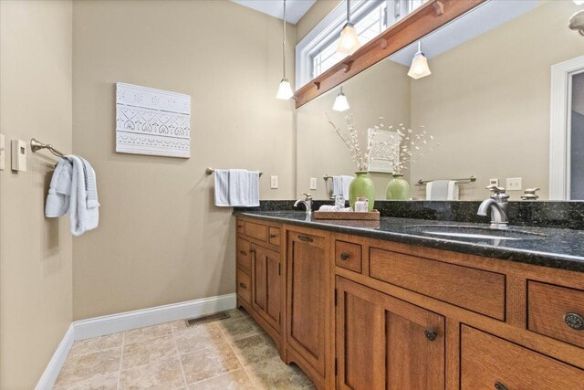 2297 Deer Ridge Ct, Carlock, IL 61725 - bathroom with baseboards and double vanity