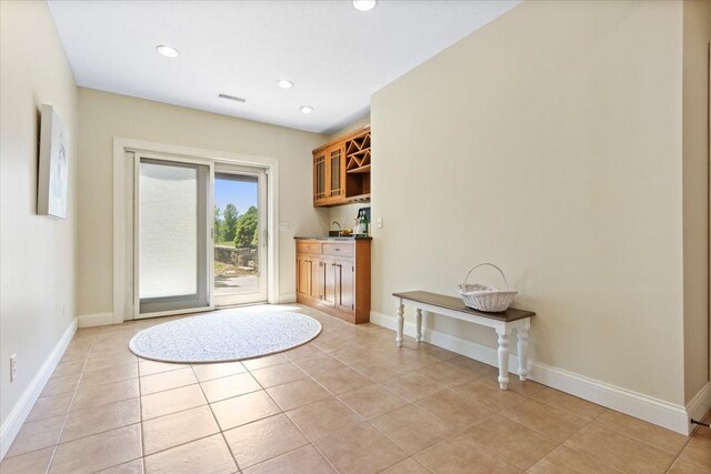 2297 Deer Ridge Ct, Carlock, IL 61725 - doorway with recessed lighting, light tile patterned floors, and baseboards