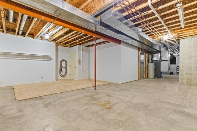 2297 Deer Ridge Ct, Carlock, IL 61725 - unfinished below grade area featuring gas water heater and heating unit