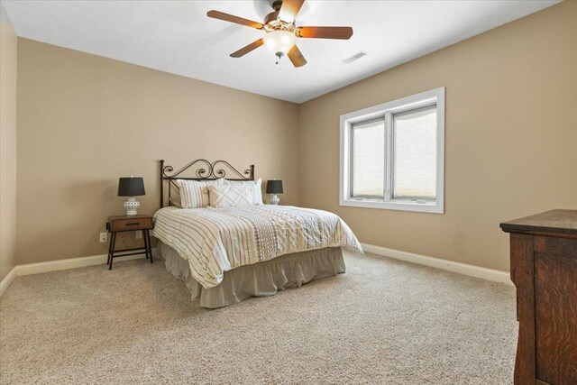 2297 Deer Ridge Ct, Carlock, IL 61725 - carpeted bedroom with baseboards and a ceiling fan