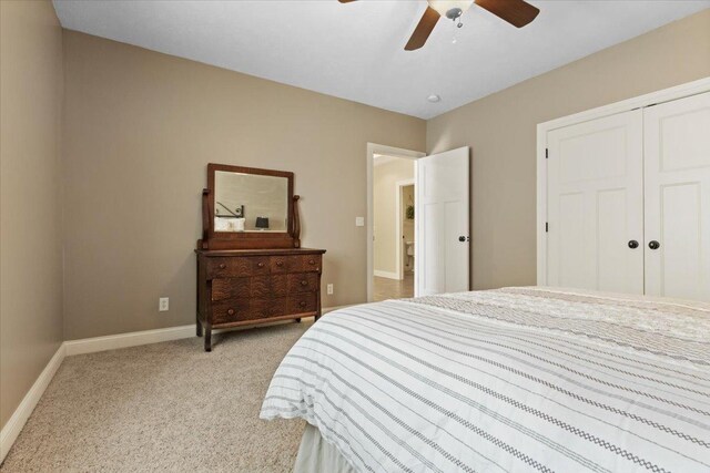 2297 Deer Ridge Ct, Carlock, IL 61725 - bedroom featuring light colored carpet, a closet, baseboards, and a ceiling fan