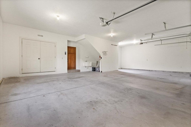2297 Deer Ridge Ct, Carlock, IL 61725 - garage featuring a garage door opener