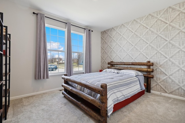 bedroom featuring multiple windows, carpet floors, and baseboards
