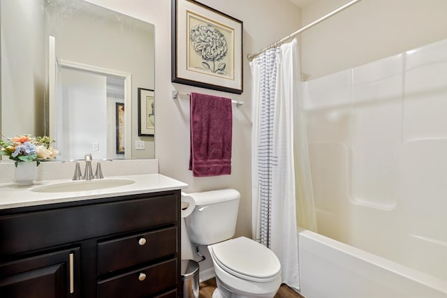 full bath featuring toilet, vanity, and shower / tub combo