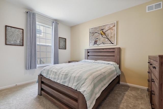 bedroom featuring carpet flooring and baseboards