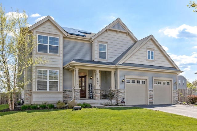 12505 Carver Ln, Huntley, IL 60142 - craftsman-style home featuring roof mounted solar panels, an attached garage, driveway, stone siding, and a porch