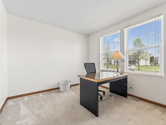 office area featuring carpet floors and baseboards