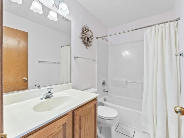 bathroom with toilet, shower / tub combo with curtain, vanity, and tile patterned floors