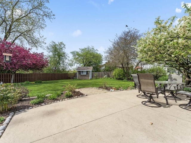 view of patio / terrace with a storage unit, an outbuilding, and outdoor dining space