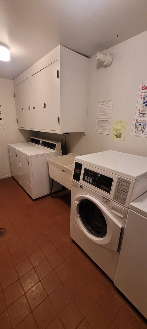 7234 W N Ave Unit 604, Elmwood Park, IL 60707 - laundry room with washer and dryer, cabinet space, and dark tile patterned flooring