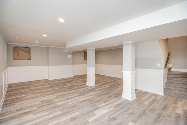 7605 S Champlain Ave, Chicago, IL 60619 - finished basement with light wood-style flooring, recessed lighting, stairway, and wainscoting