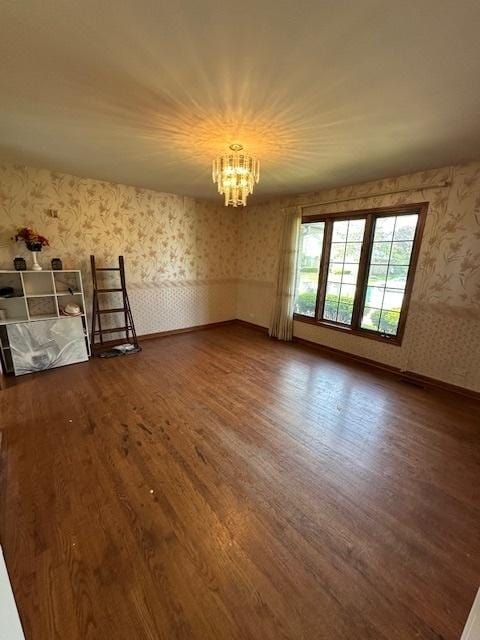 8005 W 143rd Pl, Orland Park, IL 60462 - spare room featuring wallpapered walls, dark wood-style floors, and a chandelier