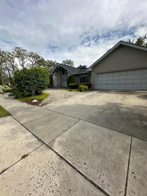 8005 W 143rd Pl, Orland Park, IL 60462 - view of front of house with an attached garage and concrete driveway